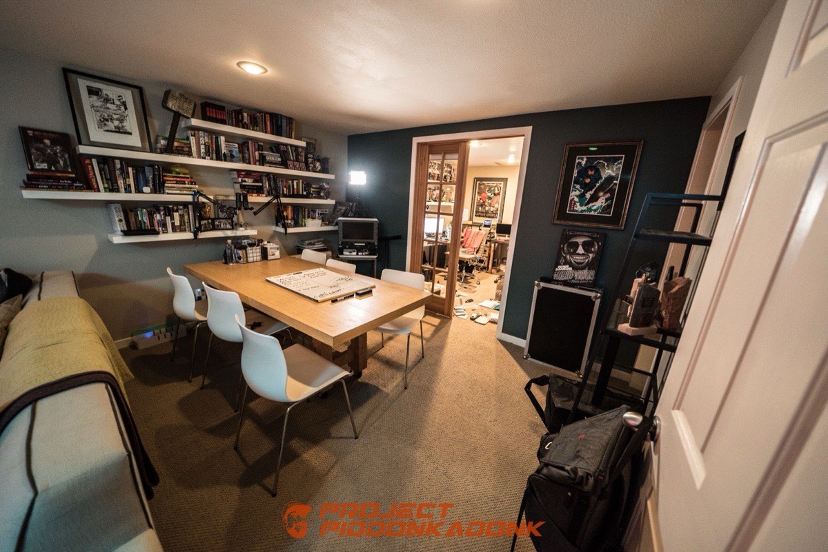 A quiet office with a long table and shelves of records